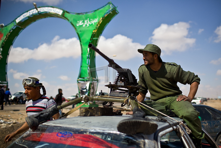 Libya 1st April 2011..Benghazi based Anti Gadaffi freedom fighters 10km outside the recaptured town of Brega and on route to the ever moving frontline bomb rebel 'Shabaab' freedom fighters despite being bombed by Nato aircraft..Gadaffi's forces regaining ground close to Aljabya for the sixth time in two weeks. This after the coalition forces handed over the defensive action to Nato who has ceased bombing targets that were seen as harmful to civilians in Libya.